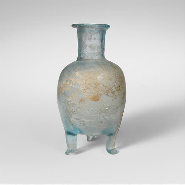 Glass bottle with three feet