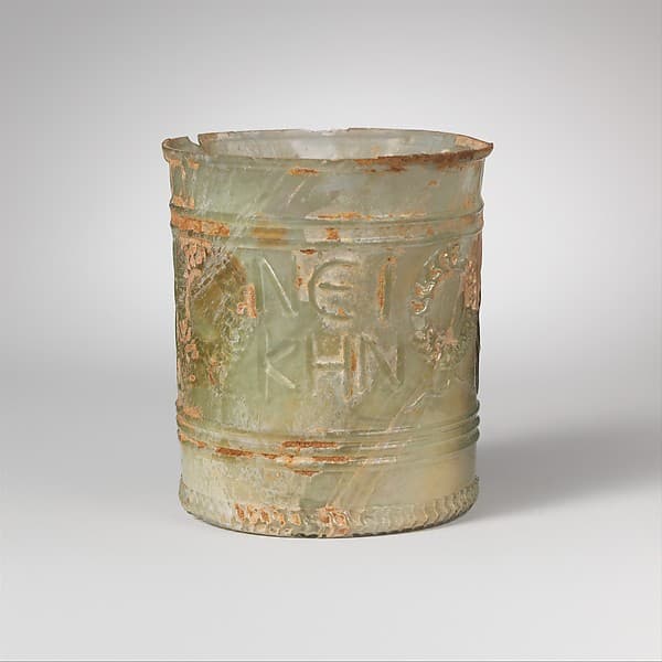 Glass beaker with inscription