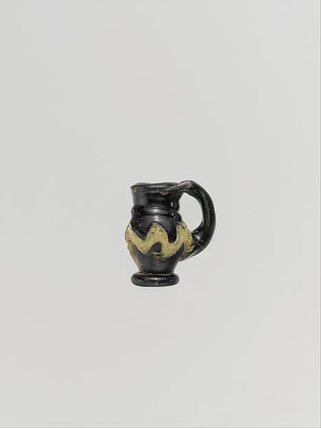 Glass pendant in the form of a miniature jug