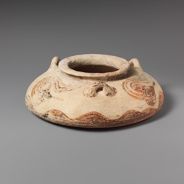 Terracotta squat alabastron (jar)