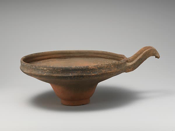 Terracotta bowl with wishbone handle