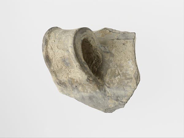 Terracotta rim and handle of a vase