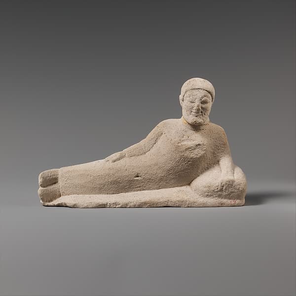 Limestone statuette of a reclining banqueter