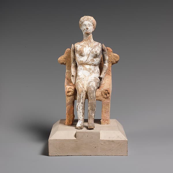 Terracotta figurine of a young woman with articulated arms seated on a chair