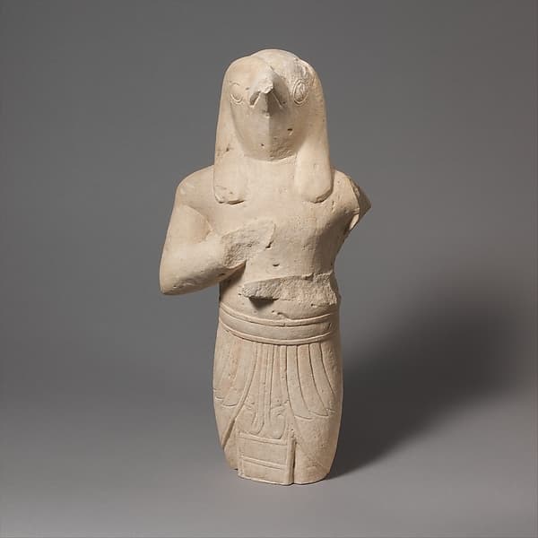 Limestone statuette of a male figure with Egyptianizing features