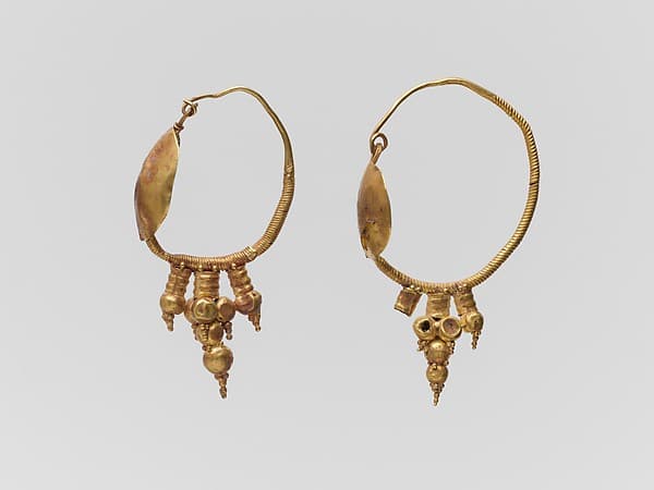 Pair of gold earrings with disk and pendant clustered spheres