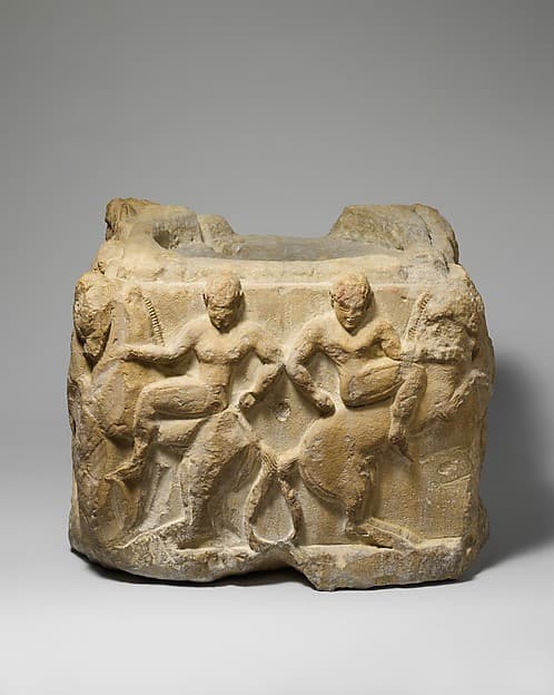 Limestone cippus base