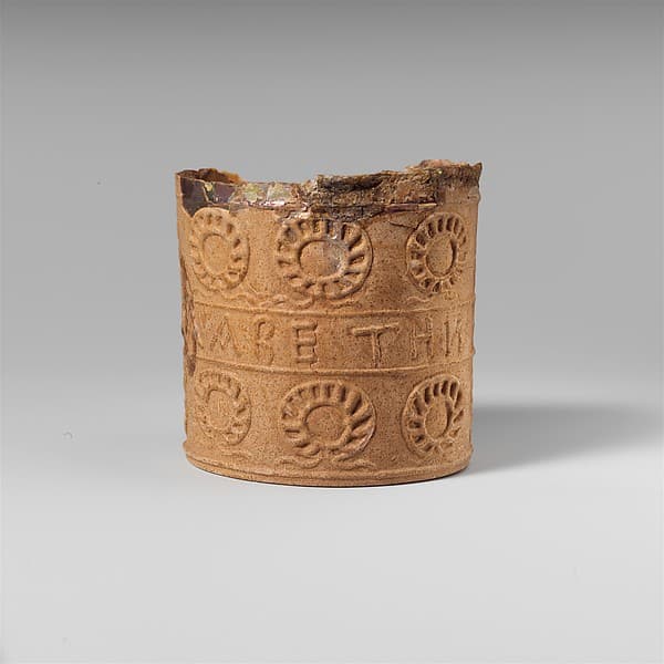 Glass beaker with inscription