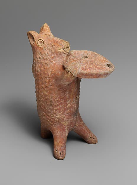 Terracotta statuette of a bear holding an oil lamp