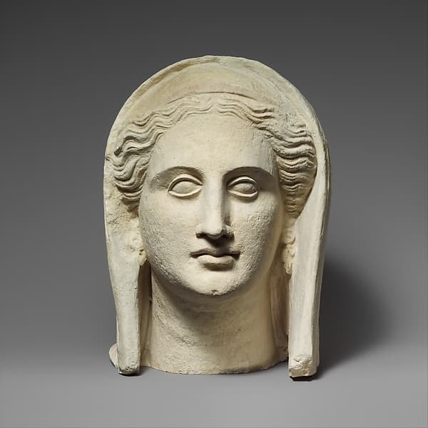Limestone head of a veiled female votary