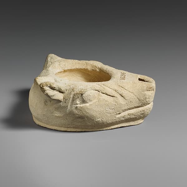 Limestone lamp in the shape of a bull’s head