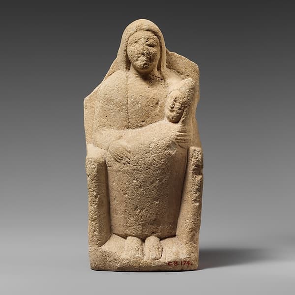 Seated limestone kourotrophos