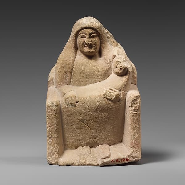 Seated limestone kourotrophos