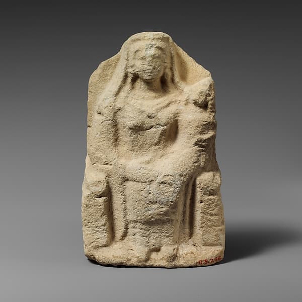 Seated limestone kourotrophos