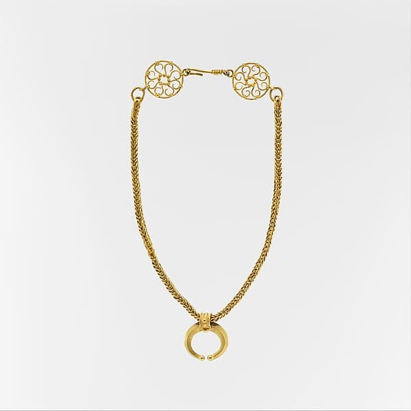 Gold necklace with crescent-shaped pendant