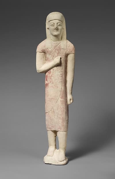 Limestone statuette of a beardless male votary in Greek dress