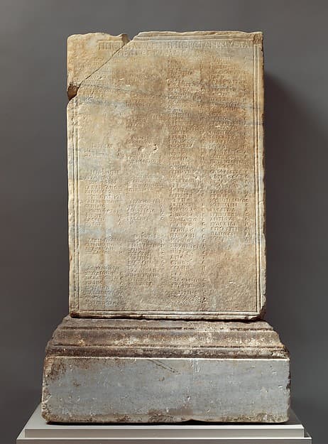 Marble inscribed statue base