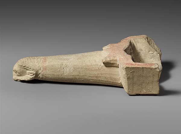 Limestone handle of a patera or a fire shovel ending in a ram’s head