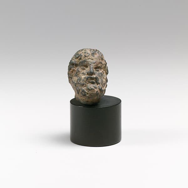 Bronze head of a bearded man or god
