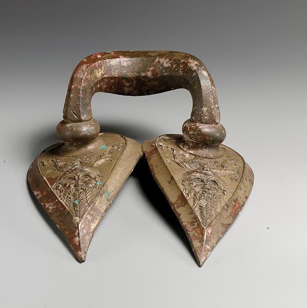 Bronze handle of a vessel with Silenos mask