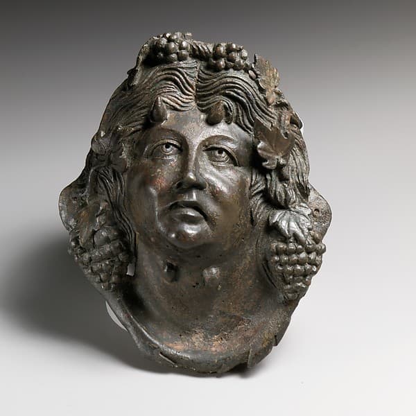Bronze attachment in the form of the head of Pan