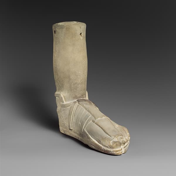 Limestone votive (?) foot with a sandal