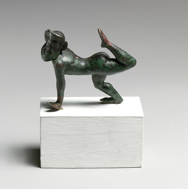 Bronze statuette of a satyr dancing