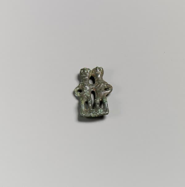 Bronze pendant in the form of a paired couple