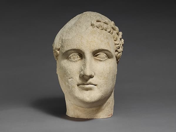 Limestone head of a beardless male votary