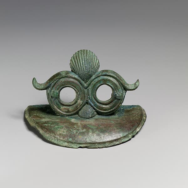 Pair of bronze handle attachments from a situla (bucket)