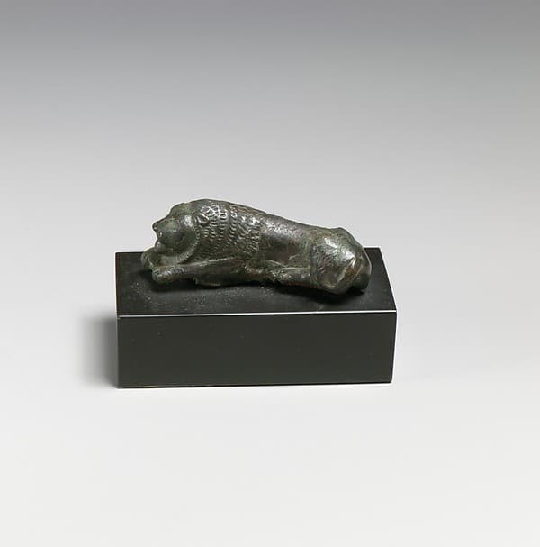 Bronze statuette of a recumbent lion