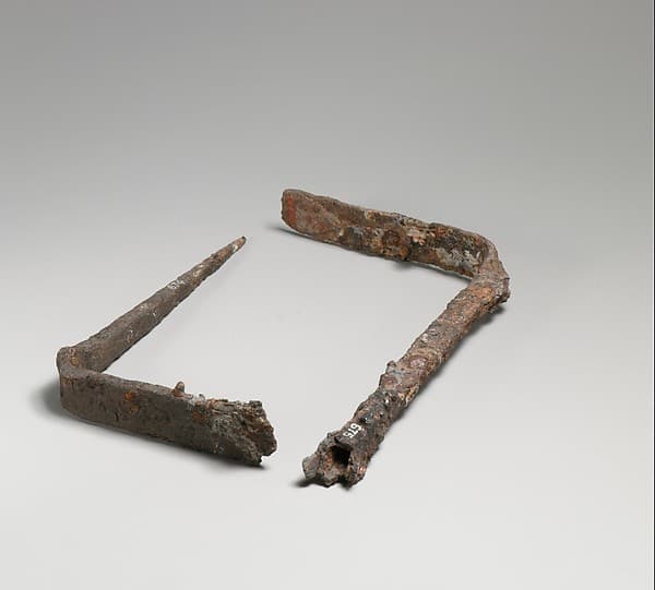 Two fragmentary iron fire-rakes