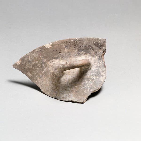 Terracotta rim, handle, and upper body of a bowl