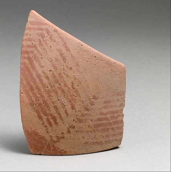 Terracotta rim fragment with linear decoration