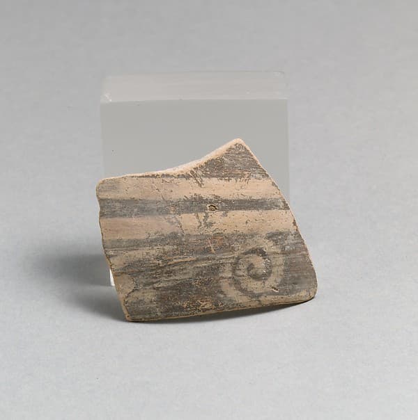 Terracotta rim fragment with running spiral