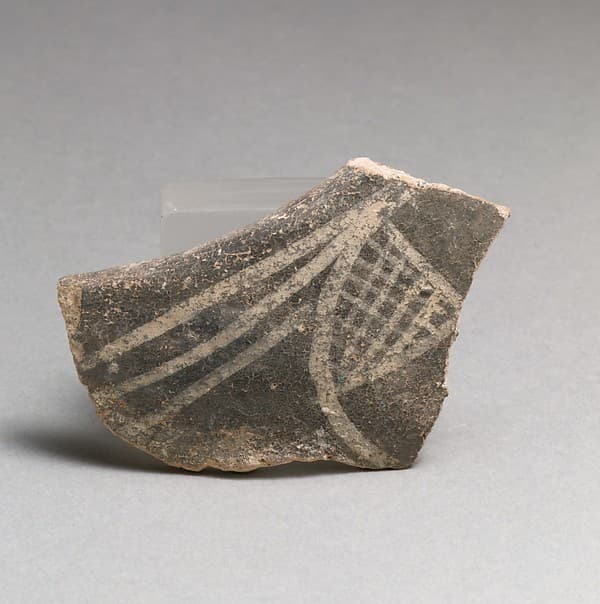Terracotta rim fragment with hatched triangle