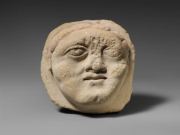 Limestone votive head