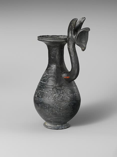 Terracotta jug with griffin protome handle