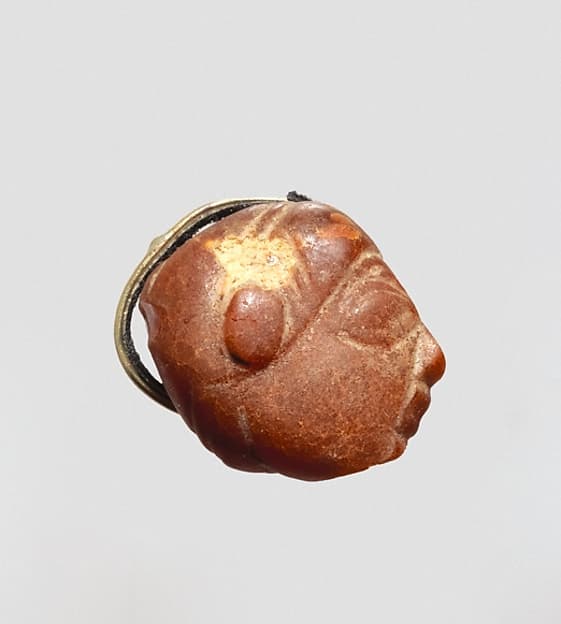 Pendant: winged female head