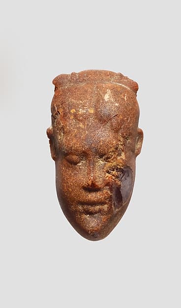 Pendant: head of a woman