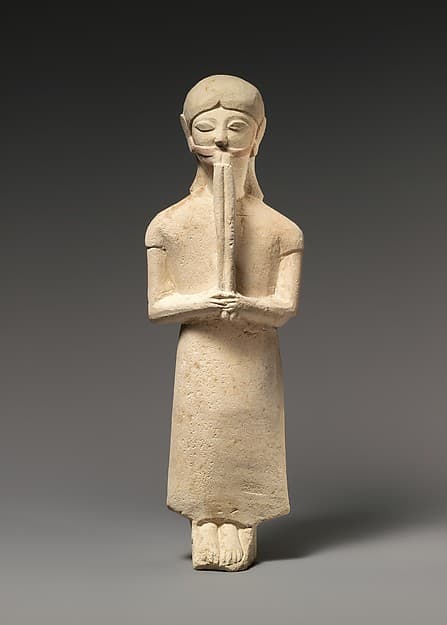 Limestone flute-player