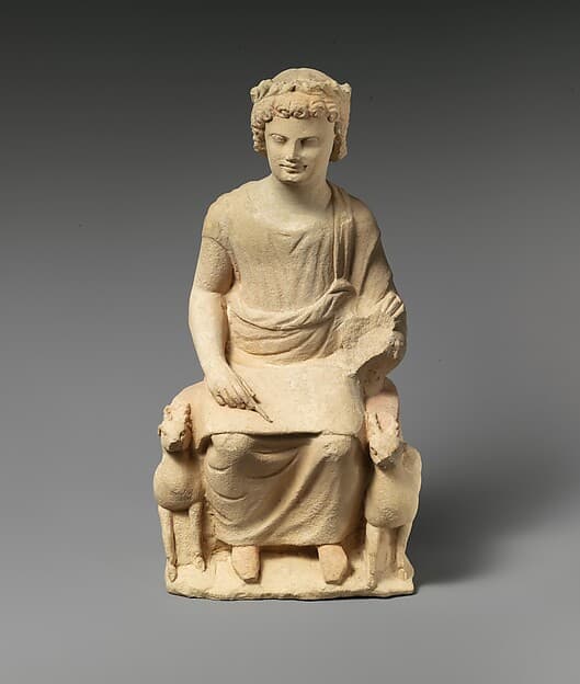 Limestone statue of an enthroned youth