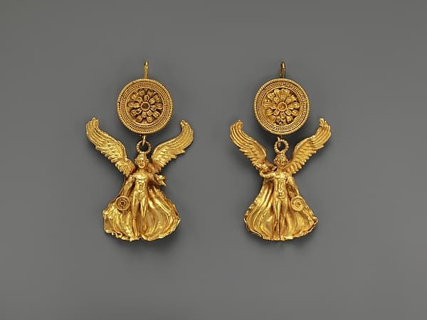 Pair of gold earrings with a disk and Eros