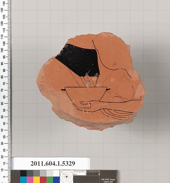 Terracotta fragment of a kylix (drinking cup)