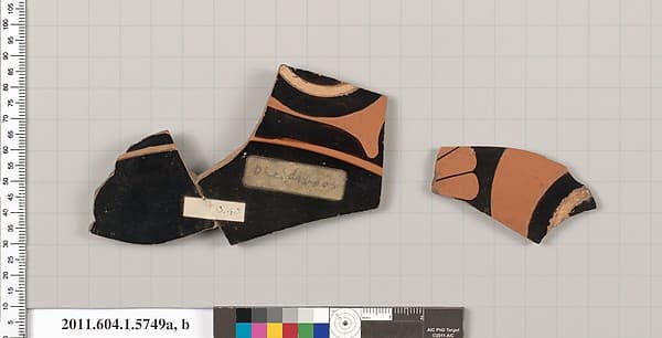Terracotta fragments of a kylix: eye-cup (drinking cup), by Pheidippos