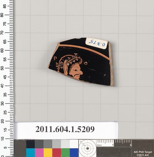 Terracotta fragment of a kylix (drinking cup)