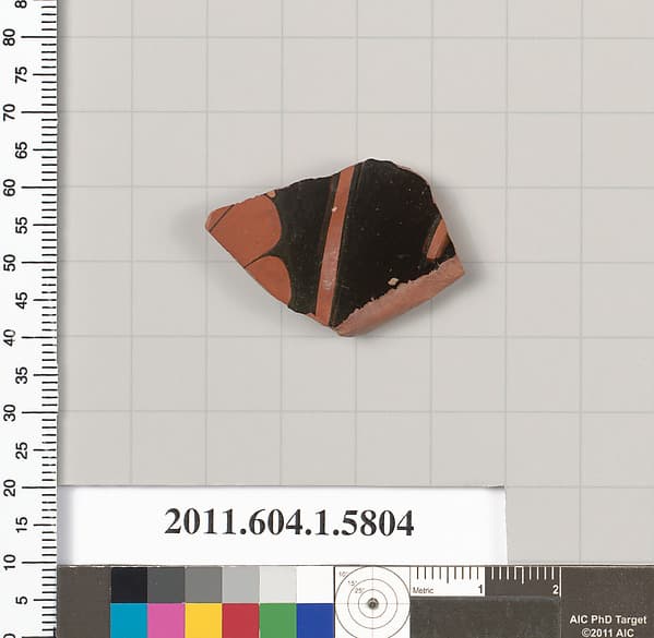 Terracotta fragment of a kylix: eye-cup (drinking cup), by Epeleios Painter