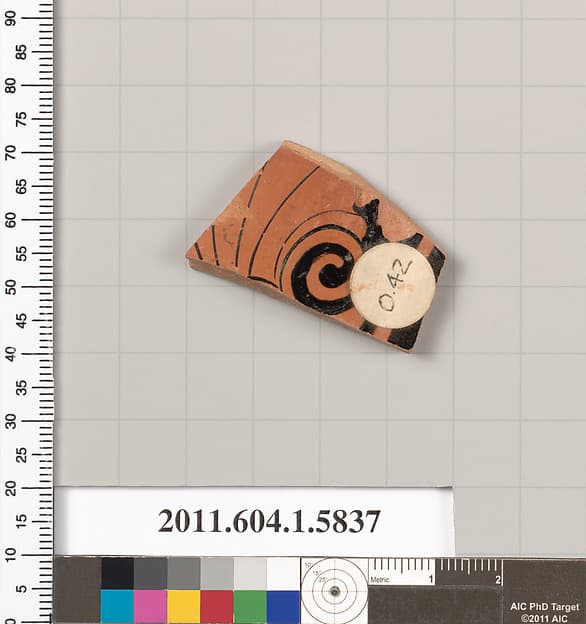 Terracotta fragment of a kylix: eye-cup (drinking cup)