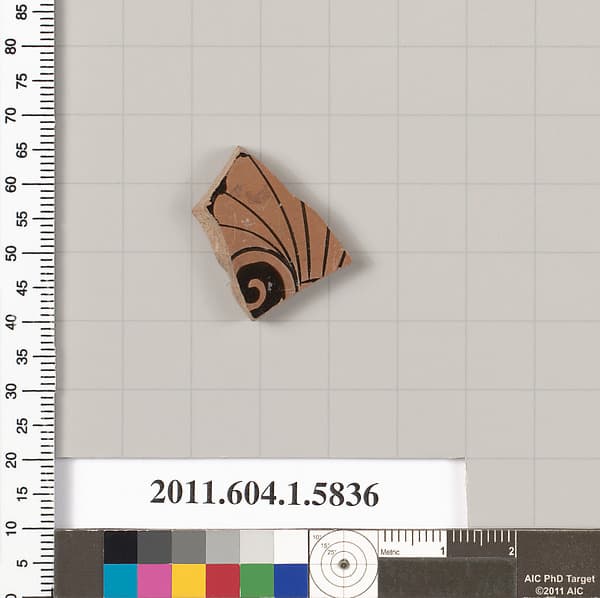 Terracotta fragment of a kylix: eye-cup (drinking cup)