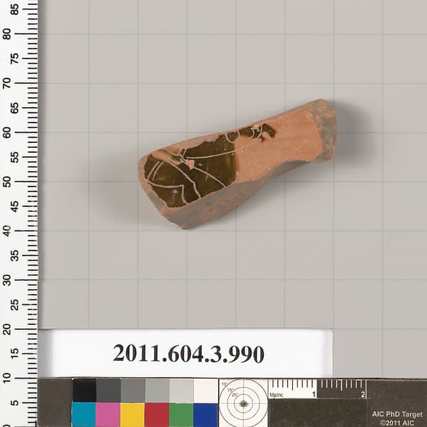 Terracotta fragment of a lekanis lid (covered dish)
